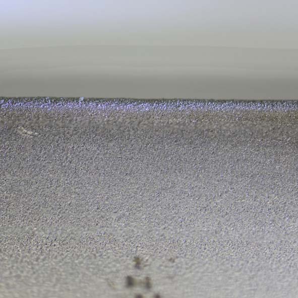 Stainless steel edge after deburring at 245 MPa