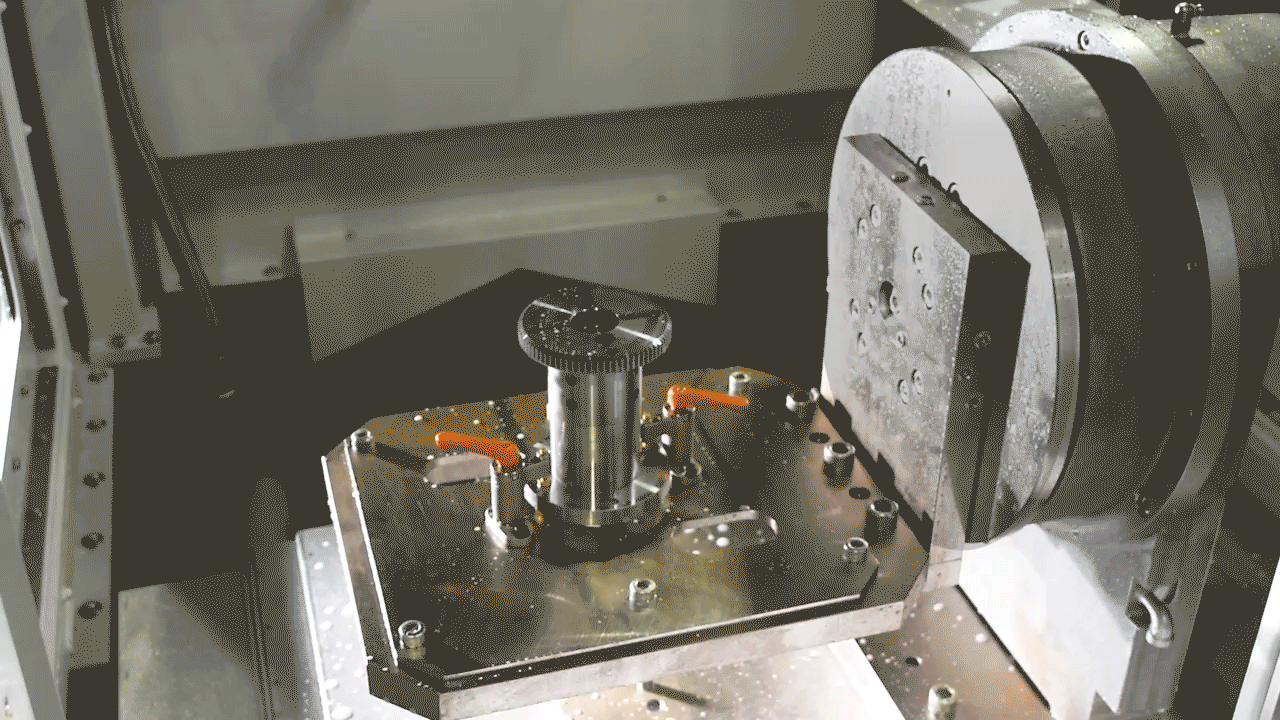 Rotating axis in the Sugino JDM jet deburring machine to deburr all sides of a part