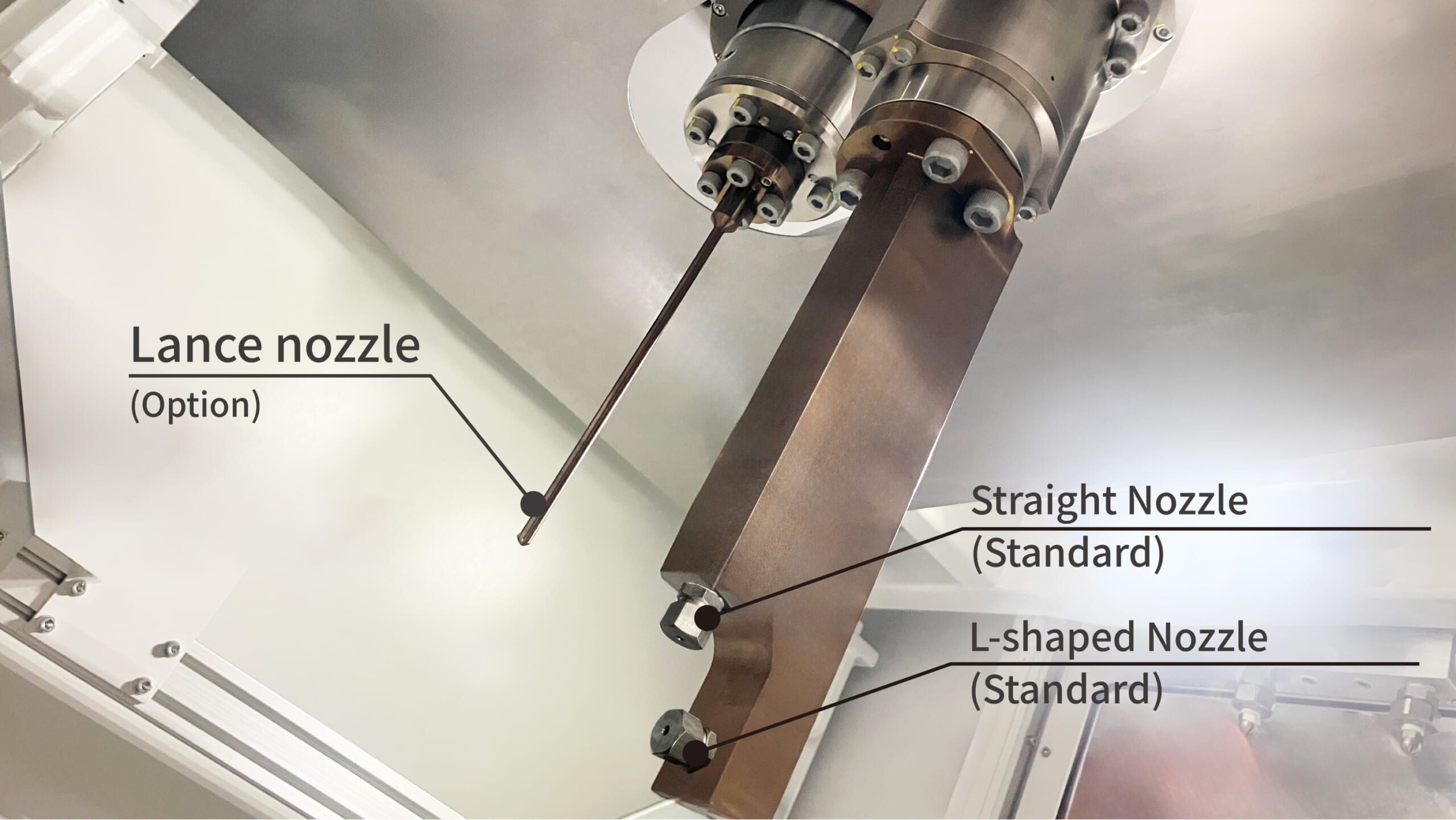 The straight nozzle, lance nozzle, and angled nozzle inside Sugino's JDM Jet Deburring Machine for removing burrs from metal parts